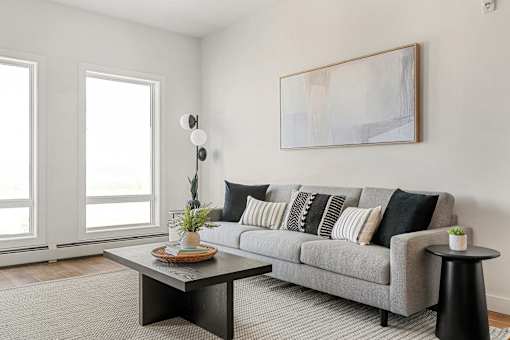 A Living Room With a Coffee Table at Podium Apartments, Calgary, Alberta