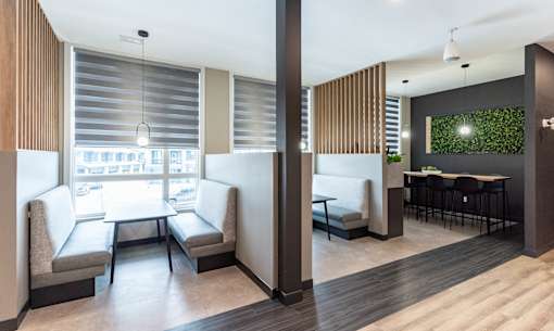 A modern room with a table and chairs.