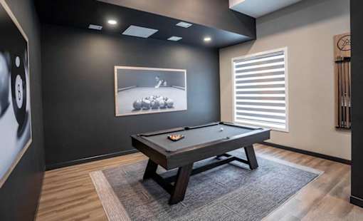 A pool table with a billiard ball on it.