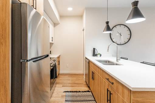 A Kitchen With a Refrigerator at Cadence at Griesbach, Edmonton, T5E 1Y8