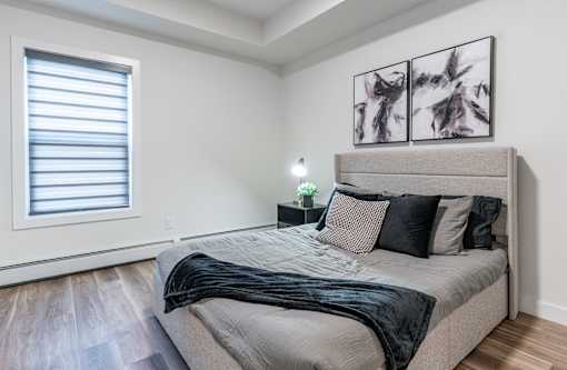 A Bedroom With a Large Bed at Cadence at Griesbach, Edmonton, Alberta