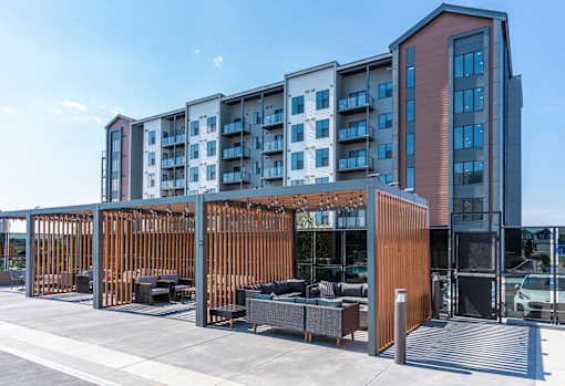 A modern building with a wooden fence in front.