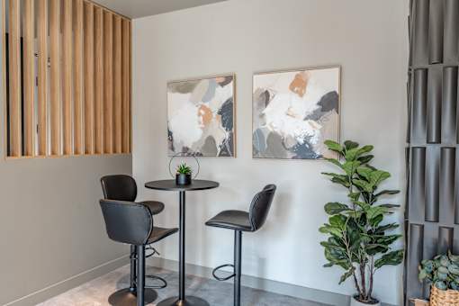 A room with a table and two chairs. at Raymond Block, Edmonton, AB