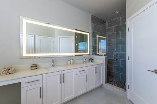 Bathroom with large mirror at The Falls of Portofino , Naples, Florida