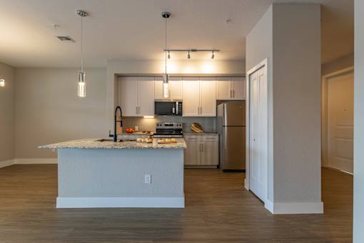 Kitchen with white island at The Falls of Portofino , Naples, Florida