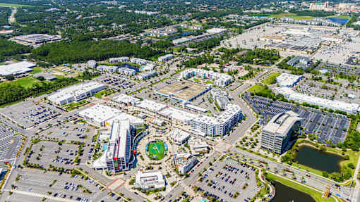 An aerial view of a large city with a mix of buildings and green spaces.at Icon One, Daytona Beach, Florida