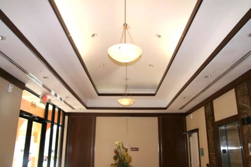 View of elegant coffered ceilings within Portofino Plaza lobby entry