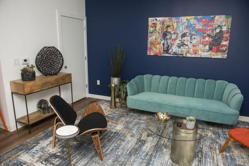 a living room with blue walls and a blue couch