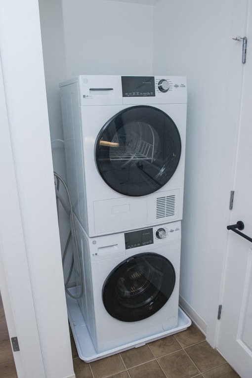 a washing machine and dryer in a small room