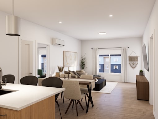 A modern kitchen with a dining table and chairs.