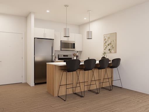 A modern kitchen with a bar stool and a fridge.