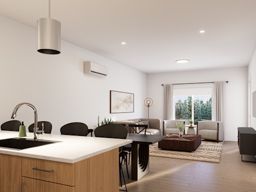 A modern kitchen with a large island and a dining area with chairs.