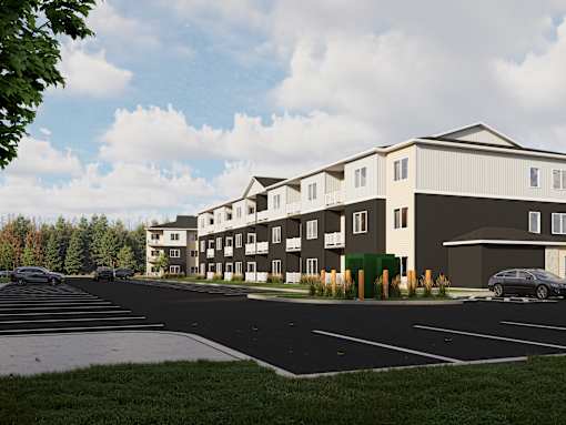 A large building with a parking lot in front of it.