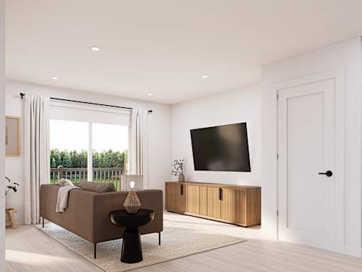 A modern living room with a brown sofa, a black coffee table, and a flat-screen TV mounted on the wall.