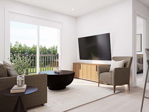 A modern living room with a flat screen TV mounted on the wall.