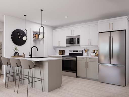 A modern kitchen with a large island and stainless steel appliances.