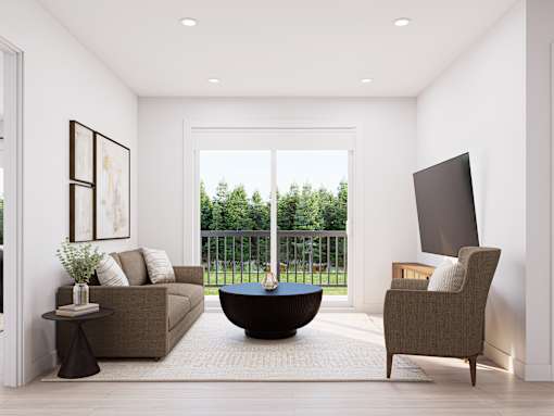 A modern living room with a brown sofa, a black table, and a large window overlooking a green lawn.