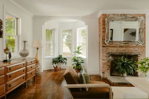 A living room with a fireplace and a couch.