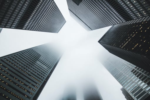 a group of tall buildings reaching into the sky