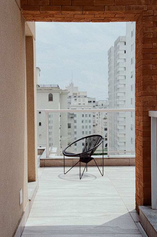 chair on balcony with city view