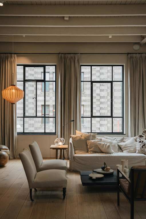 a living room with a couch and a window