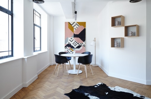 breakfast nook with large windows and a hardwood floor