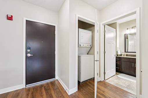 A black door with a silver handle is on the left.