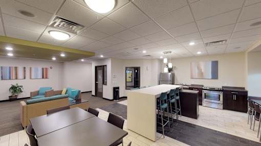 A modern kitchen and dining area in a commercial space.