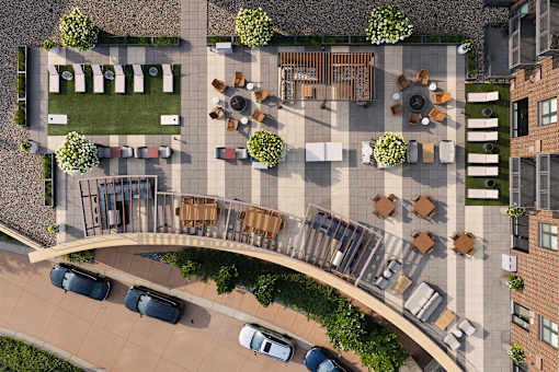 A top view of a parking lot with cars and a building.
