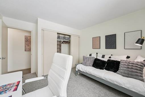 Room with chair and couch at The Bosk Apartment Homes, Minnesota