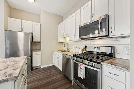 Kitchen with stove top oven at 71 France, Edina, 55435