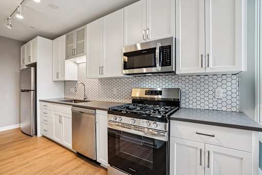 Kitchen with white cabinetry and stove top oven at Arcata Apartments, Golden Valley, MN, 55416