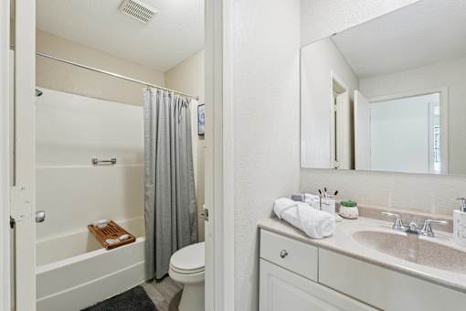 White Bathtub in Bathroom at The Bosk Apartment Homes, Woodbury, MN