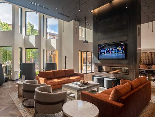 a living room filled with furniture and a flat screen tv