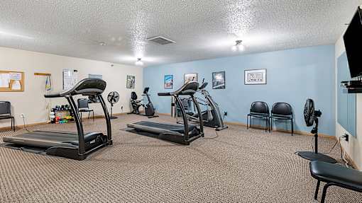 our gym has plenty of exercise equipment and chairs for residents to use