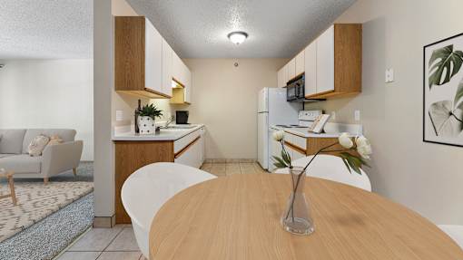 a dining room table with a vase of flowers and a kitchen and living room