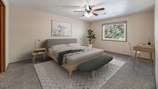 a bedroom with a bed and a ceiling fan