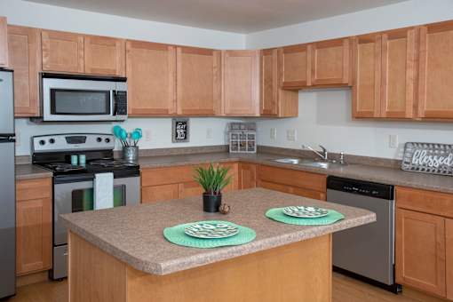 Kitchen with Wood Cabinets and Island