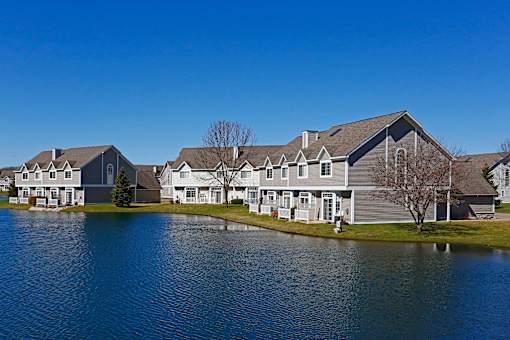 Exterior image of Avalon Cove Townhomes looking out onto the water of the cove.