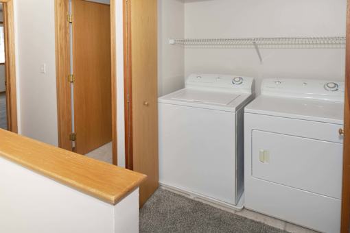 a small laundry room with a washer and dryer