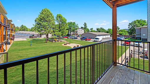 a view of the yard from the balcony of a house