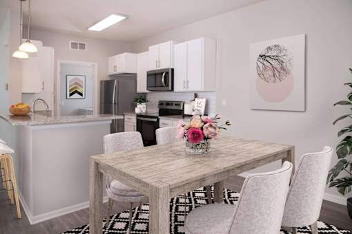 Modern and spacious dining area looking into open kitchen.