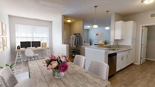 a dining room and kitchen with a desk and computer