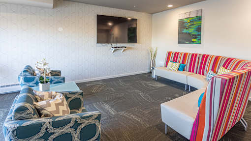a living room with couches and a television