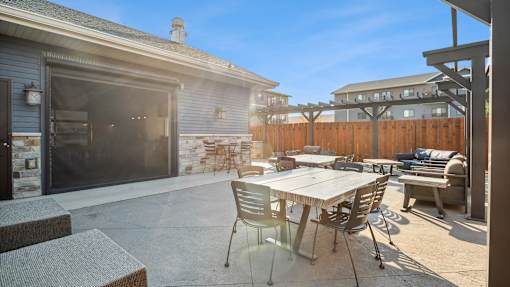 A patio with a table and chairs is shown.