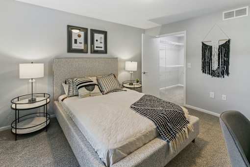 a bedroom with a bed and a closet