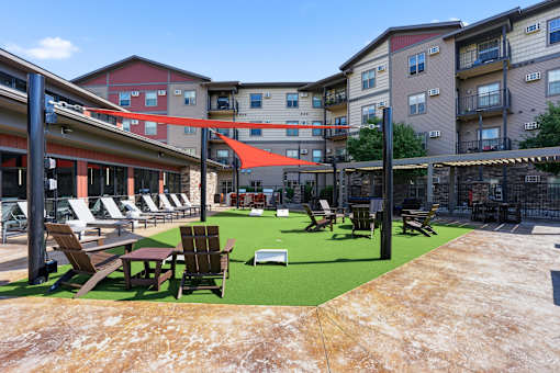 A sunny day at the outdoor seating area of a hotel or apartment complex.
