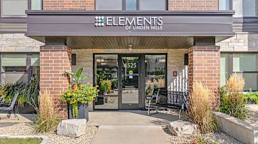 The front of a building with the name Elements of Linden Hills on it.