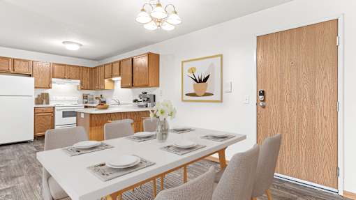 our modern kitchen and dining room with a white table and chairs