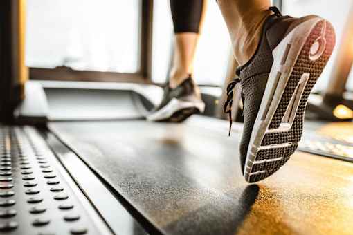 people running on a treadmill in a gym
